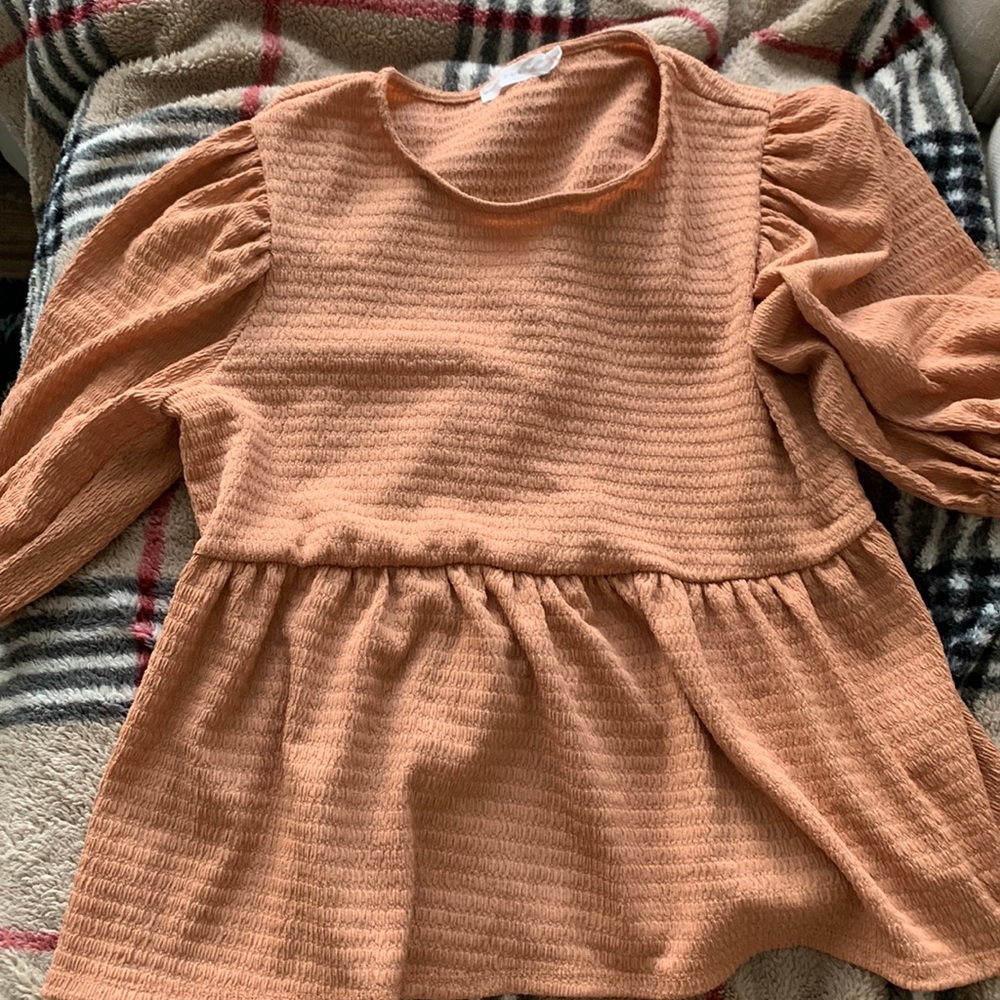 Lush apricot colored shirt looks great with jeans